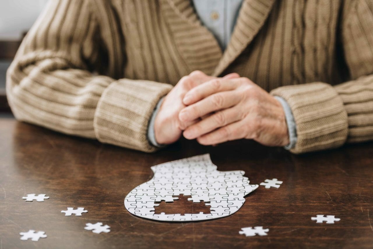 https://www.aplawgroup.com/wp-content/uploads/2021/06/cropped-view-of-senior-man-playing-with-puzzles-on-3WJV47A-1-1280x854.jpg