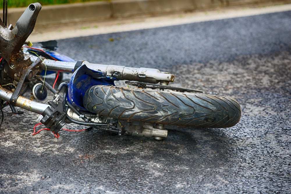 Damaged motorcycle front wheel and fork after a Texas motorcycle accident