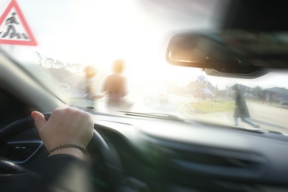 Driver's view of pedestrians crossing at a crosswalk sign in Texas