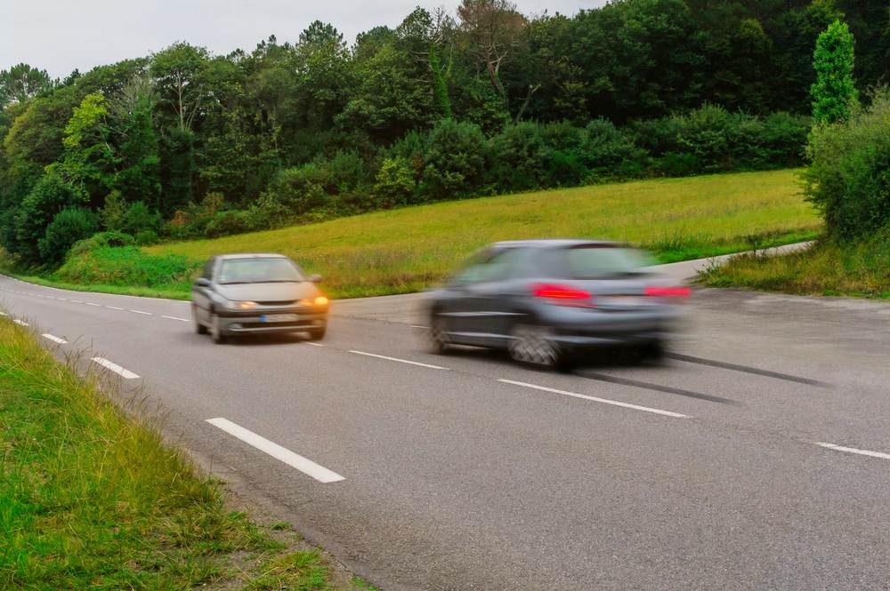 Car drifting into the oncoming lane, a common cause of head-on collisions